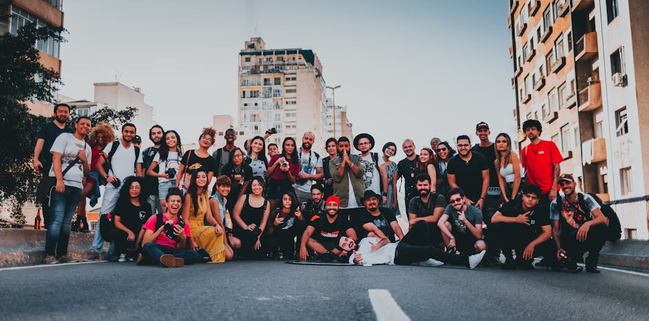 Large diverse group of friends posing happily on a street in São Paulo, Brazil.